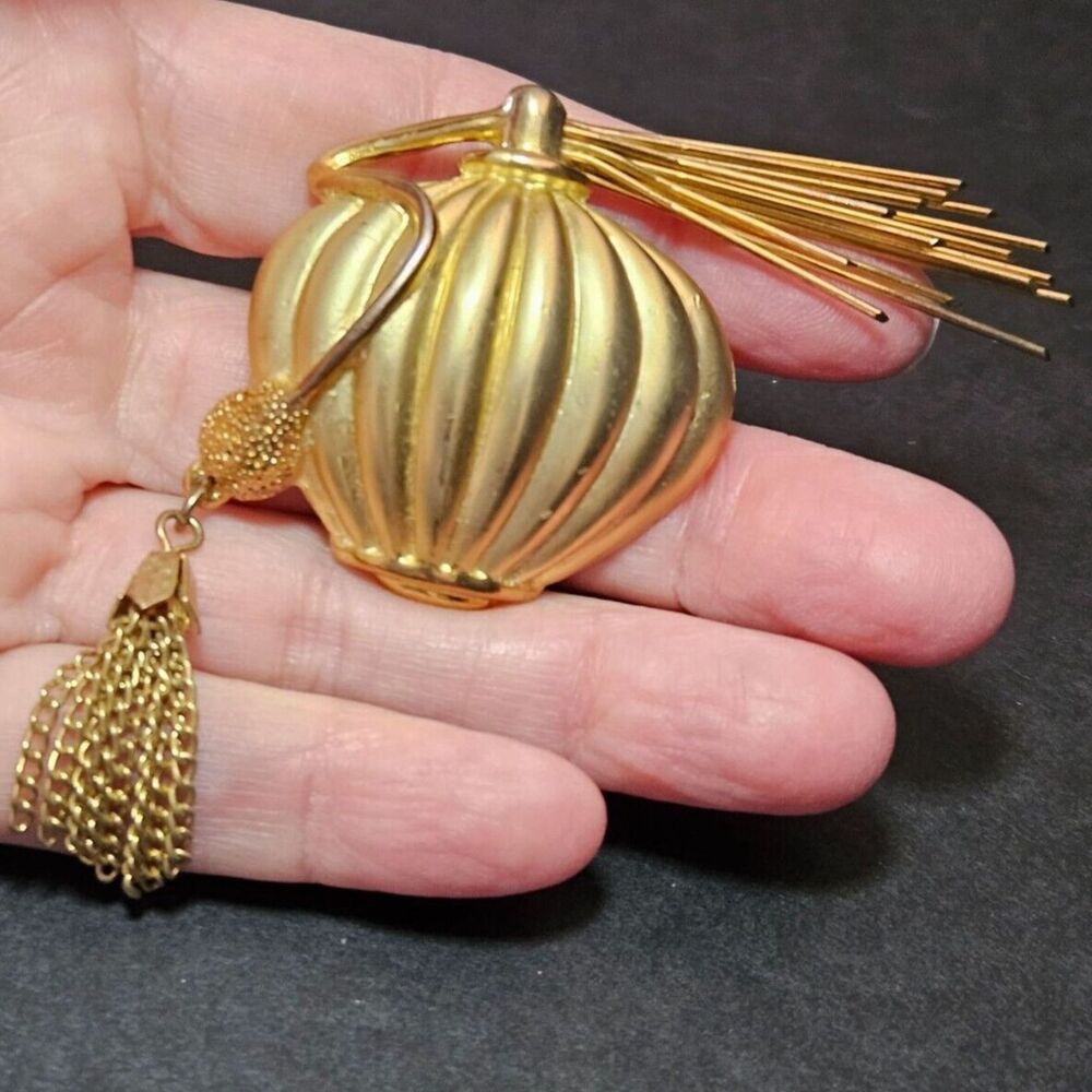 Vintage gold tone perfume bottle